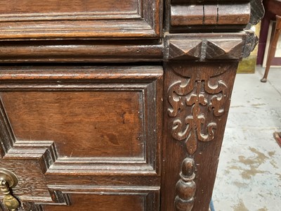 Lot 1262 - 17th century oak geometric chest with an arrangement of four long drawers, each with brass drop handles, on turned bun feet
