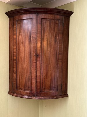 Lot 5301 - George III mahogany bow front hanging corner cupboard with inlaid ebony stringing, 105cm high
