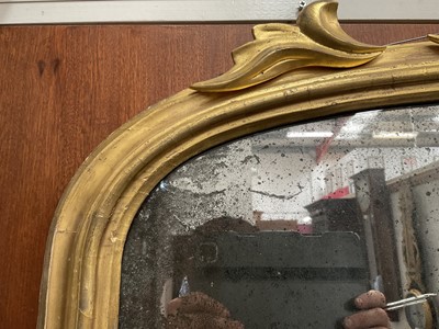 Lot 1267 - Victorian gilt framed wall mirror of arched form with foliate leaf cresting, 110cm wide x 74cm high
