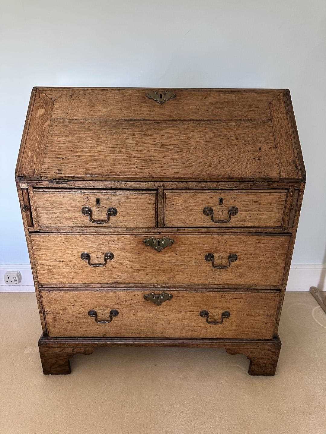 Lot 1271 - George III light oak bureau with fitted interior above two short and two long drawers, on bracket feet, 84cm wide x 50cm deep x 99cm high