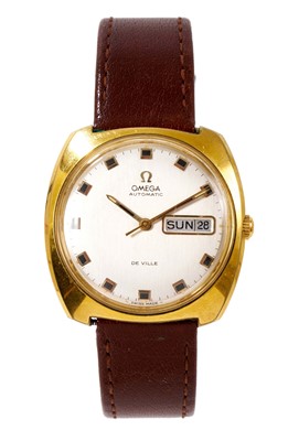 Lot 529 - 1970s Gentlemen's Omega Automatic De Ville calendar wristwatch in tonneau shape gold plated case on later brown leather strap, with original Omega guarantee from Bonner & Sons, Colchester, 27...