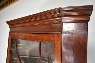 Lot 1288 - George III mahogany two height standing corner cupboard