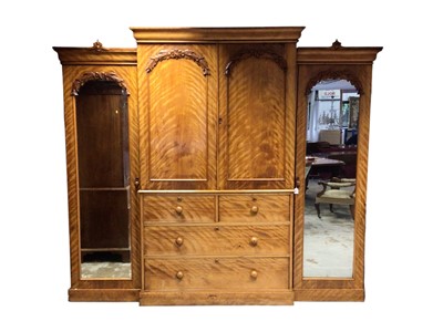 Lot 1253 - Victorian satin birch breakfront compactum wardrobe, the central section with slides enclosed by panel doors and two short over two long drawers below, flanked by mirrored wardrobes, on plinth c...