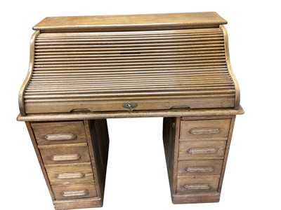 Lot 1360 - Early 20th century oak roll top desk with fitted interior enclosed by tambour shutter, 121cm wide, 76cm deep, 112.5cm high