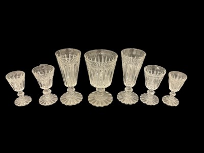 Lot 87 - Victorian glass table service, each drinking glass with tapered fluted bowl on fluted pedestal bases