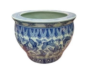 Lot 551 - Contemporary Japanese porcelain jardinere with blue and white butterfly decoration.