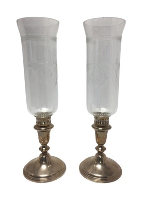 Lot 198 - Pair contemporary silver candlesticks, with inverted bell shaped stems, on circular weighted bases