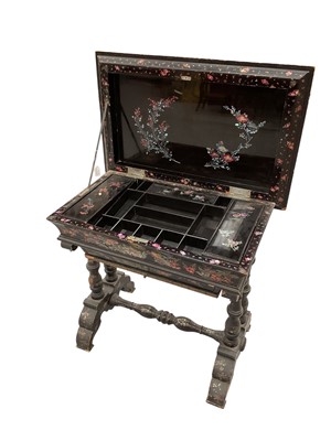 Lot 1268 - 19th century Chinese papier mâché and mother of pearl inlaid work table, the hinged rectangular cushion top inlaid with fighting cocks and enclosing a fitted interior with cushion drawer below o...