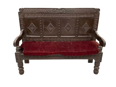 Lot 1206 - Impressive 18th century and later carved oak settle, with four lozenge panel back and solid seat on carved knopped legs, 162cm long