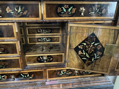 Lot 1432 - Good William & Mary walnut oyster veneered, specimen wood and green stained ivory marquetry inlaid cabinet on later stand, with cushion frieze drawer and fitted interior of drawers about centr...