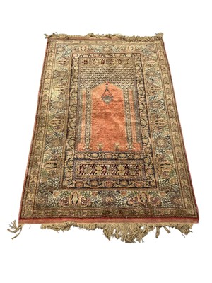 Lot 1293 - Persian silk prayer rug, with central mirhab in foliate meander borders and tassel ends, 190 x 100cm