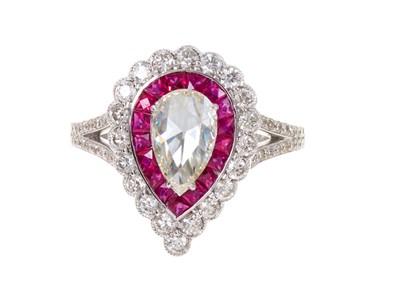 Lot 440 - Diamond and ruby cluster ring with a central pear-cut diamond surrounded by a border of calibre cut rubies and a further border of brilliant cut diamonds in 18ct white gold setting, ring size P½...