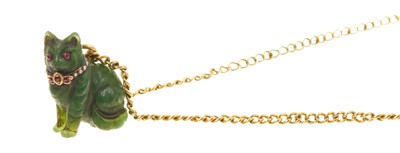 Lot 446 - Carved green hardstone cat pendant with garnet and seed pearl collar, on a yellow metal chain