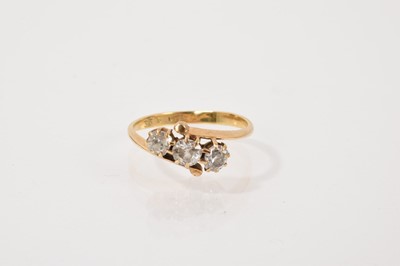 Lot 701 - 18ct gold three stone diamond ring