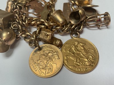 Lot 19 - 9ct gold double row curb link charm bracelet with various 9ct gold and yellow metal charms including a George V gold full sovereign, 1913 and George V gold half sovereign 1912