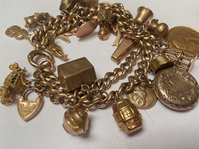 Lot 19 - 9ct gold double row curb link charm bracelet with various 9ct gold and yellow metal charms including a George V gold full sovereign, 1913 and George V gold half sovereign 1912
