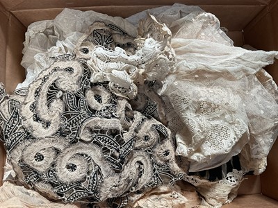 Lot 2144 - Box of handmade and machine made lace including wide and narrow collars, lappets, bonnet veil, Limerick lace square veil, dress front etc.