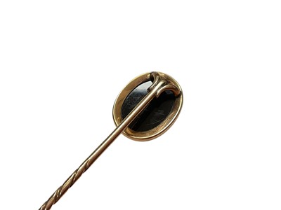 Lot 25 - Edwardian 15ct gold blue stone and seed pearl bar brooch, yellow metal bar brooch set with three cultured pearls, freshwater pearl stick pin and a cameo stick pin (4)