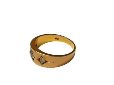 Lot 89 - 18ct gold diamond three stone gypsy set ring