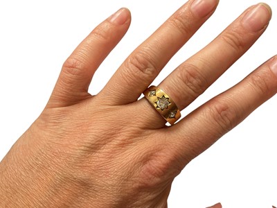 Lot 89 - 18ct gold diamond three stone gypsy set ring