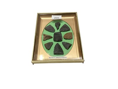 Lot 2522 - Glazed case of arrow heads