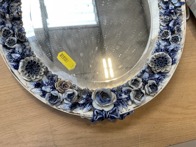Lot 5071 - Two Continental porcelain dressing table mirrors with figural decoration, (2).