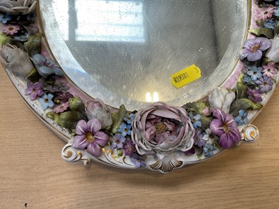 Lot 5071 - Two Continental porcelain dressing table mirrors with figural decoration, (2).