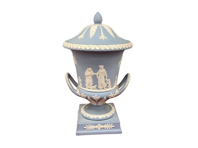 Lot 1306 - Wedgwood light blue jasperware campana vase and cover in original fitted case