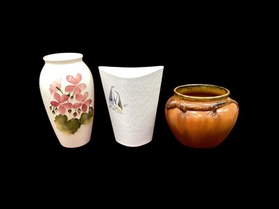 Lot 1225 - Moorcroft pottery vase with floral decoration, 19cm high, together with a Rosenthal vase decorated with penguins and another vase (3)