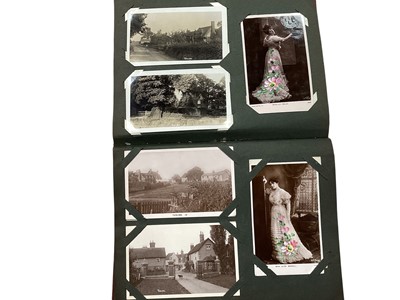 Lot 1504 - Postcards in three albums, one contains real photographic cards of Halstead, Witham, Sudbury, Terling, street scenes, greetings, views etc the two other albums contain song cards