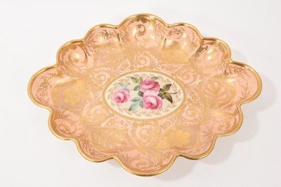 Lot 281 - Derby lobed oval dish, painted with pink roses, on a salmon and gilt ground, circa 1815