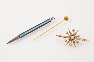 Lot 482 - Victorian seed pearl star brooch, 19th century yellow metal toothpick and a silver and enamel pencil (3)