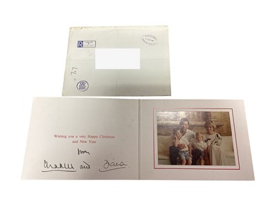 Lot 30 - T.R.H. The Prince and Princess of Wales, signed 1987 Christmas card with twin gilt Royal cyphers to cover, colour photograph of the relaxed Royal couple on holiday with the young Princes , signe...
