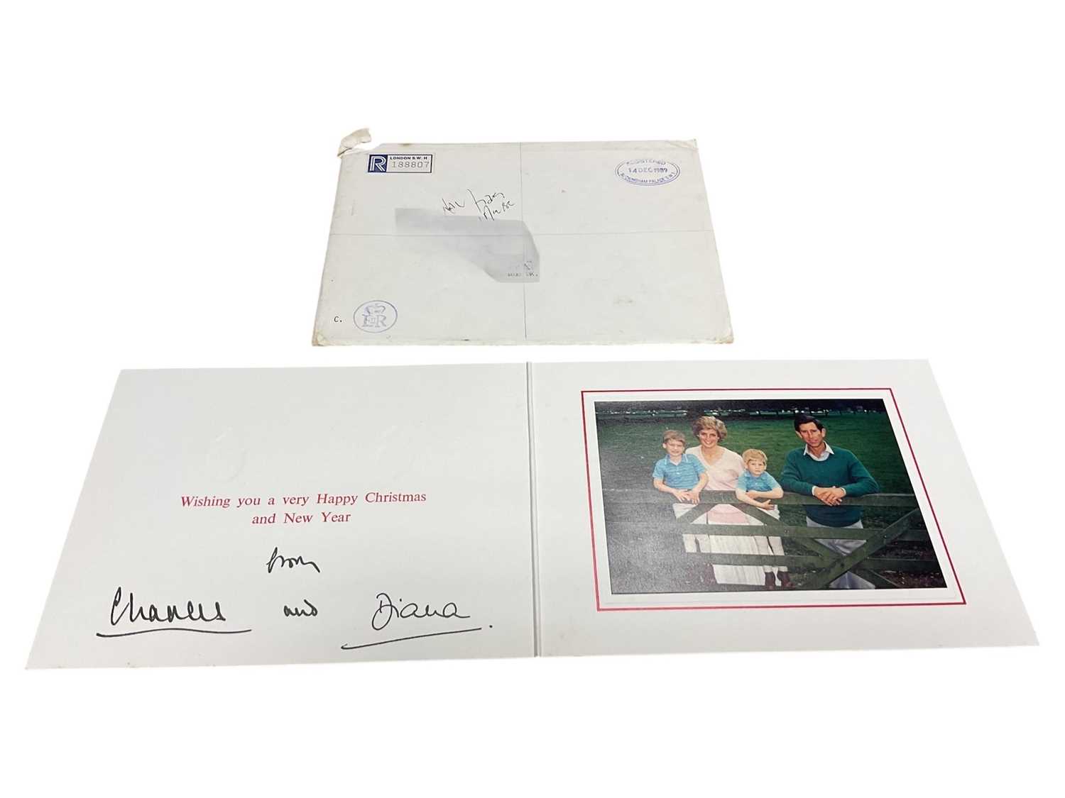 Lot 32 - T.R.H. The Prince and Princess of Wales, signed 1989 Christmas card with twin gilt Royal cyphers to cover, colour photograph of the relaxed Royal couple with the young Princes resting on a gate...