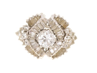 Lot 437 - Diamond cluster ring with a central brilliant cut diamond estimated to weigh approximately 0.80cts, surrounded by undulating scrolls of baguette cut diamonds with brilliant cut diamonds to the s...