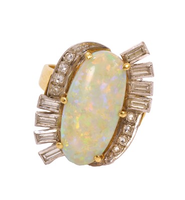 Lot 403 - Opal and diamond cocktail ring with an oval opal cabochon surrounded by baguette cut and single cut diamonds in gold and platinum setting on tapered gold shank