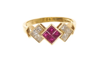 Lot 404 - Ruby and diamond ring with three geometric clusters of calibre cut rubies and princess cut diamonds in gold rub-over setting on 18ct gold shank, Lon...