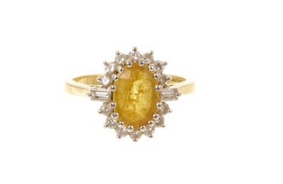 Lot 408 - Citrine and diamond cluster ring with an oval mixed cut citrine flanked by baguette cut diamond shoulders and a border of brilliant cut diamonds in claw setting on 18ct gold shank, London 1974. ...
