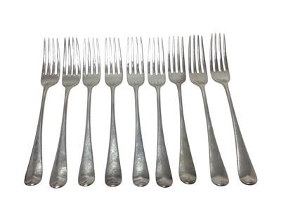 Lot 271 - Set of nine George III silver Hanoverian pattern table forks, with engraved armorial crests (London 1798), maker George Smith IV, 20.3cm overall length, all at approximately 18ozs.