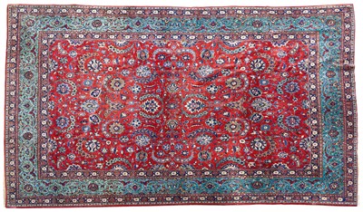 Lot 1367 - Fine kurk Kashan carpet, Central Persia, c.1910, deep terracotta field with overall scrolling curvilinear vines issuing polychrome palmettes, flower heads and leaves, within a green palmette and...