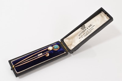 Lot 441 - Three Victorian stick pins to include an old cut diamond stick pin, a pearl stick pin and a turquoise cabochon cluster stick pin (3)