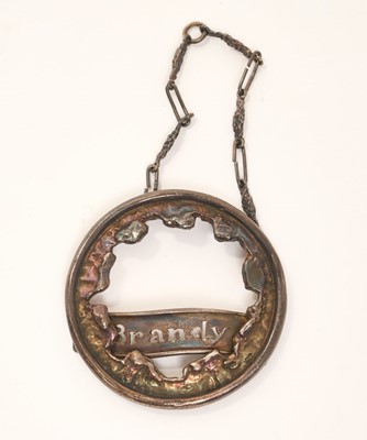 Lot 205 - John Alistair Donald (1928 - 2023), contemporary Britannia silver wine / decanter label of circular form with removable pierced central panel with naming 'Brandy', (London 1967), maker John Dona...