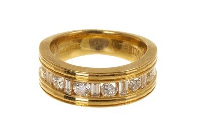 Lot 455 - 18ct gold diamond ring, the wide band with brilliant cut and baguette cut diamonds