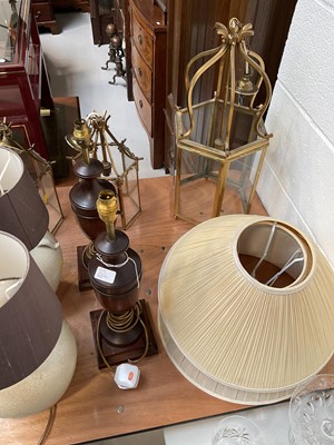 Lot 5023 - Three brass and glass ceiling lights, a par of wooden urn shaped lamps, a pottery lamp, and three shades