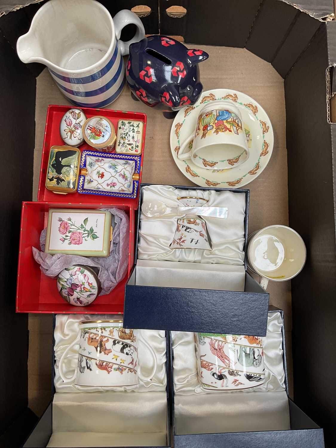 Lot 5050 - Group of Halcyon Days enamel boxes, ditto christening set, 19th century child's mug 'A present for a good boy', children's ceramics, etc