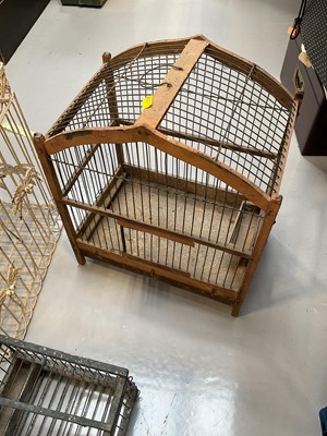 Lot 5042 - Three wire bird cages, including two with wooden frames (3)