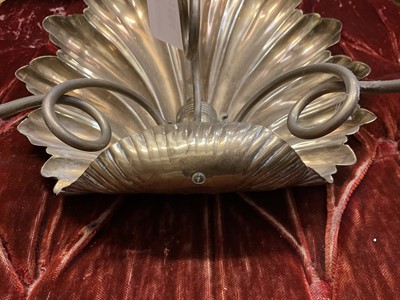 Lot 1504 - Pair of antique brass wall sconces with shell-shaped backs and three scroll candle arms