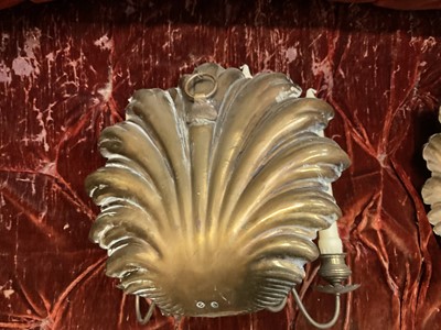 Lot 1504 - Pair of antique brass wall sconces with shell-shaped backs and three scroll candle arms