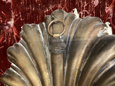 Lot 1504 - Pair of antique brass wall sconces with shell-shaped backs and three scroll candle arms
