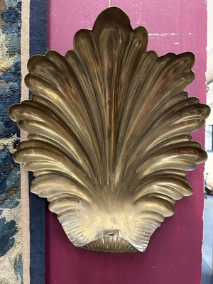 Lot 1504 - Pair of antique brass wall sconces with shell-shaped backs and three scroll candle arms